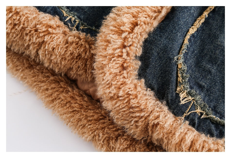 Close-up of the jacket's thick tan fuzzy collar lining beside dark denim and a frayed seam.