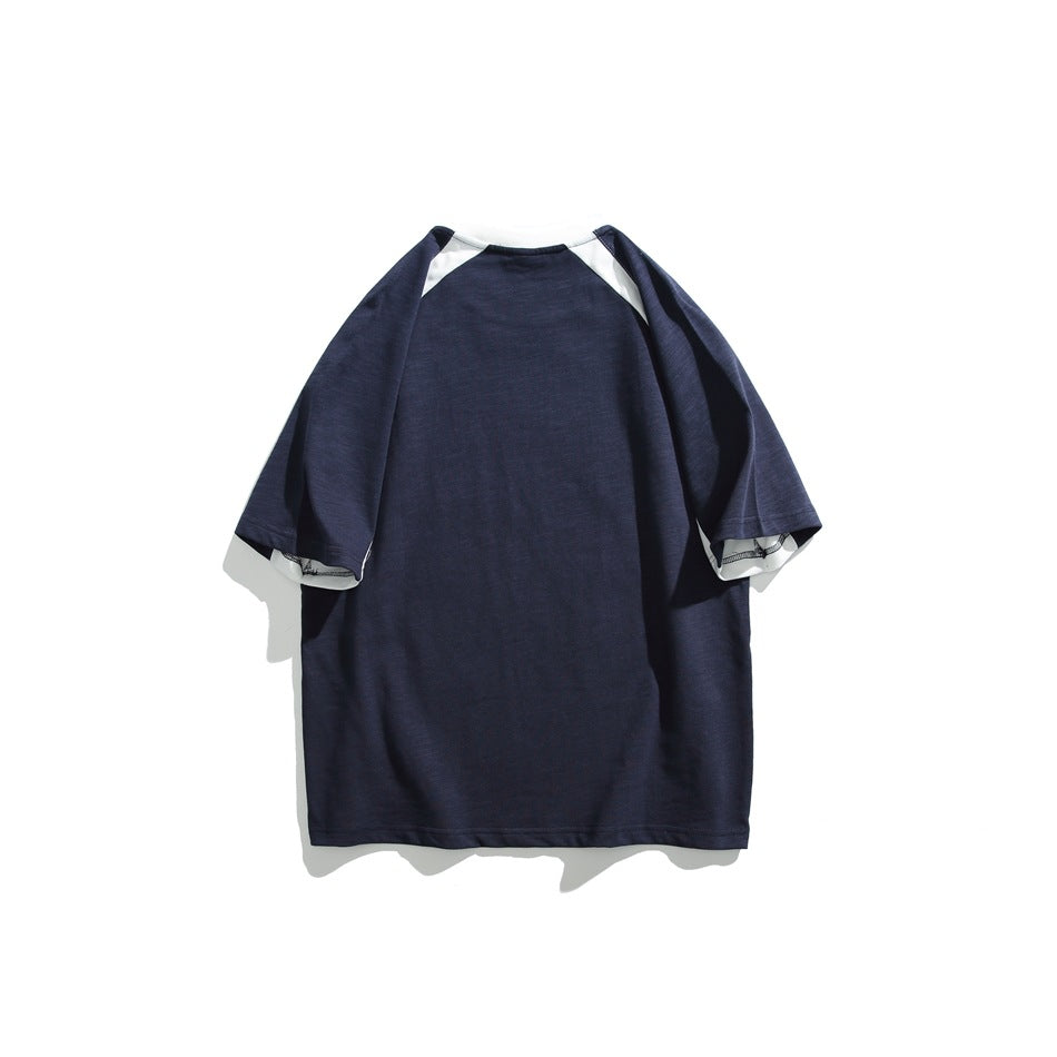 Back view of a navy short-sleeve T-shirt with white raglan shoulder accents, displayed flat.
