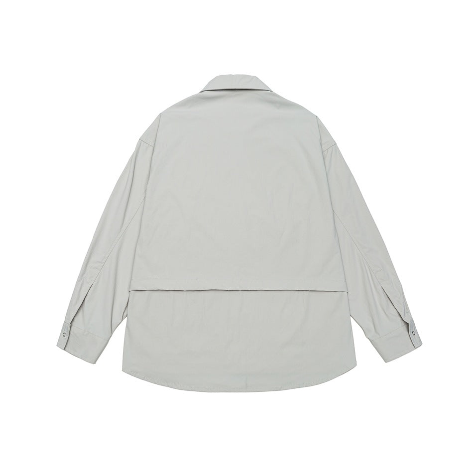 Back view of a pale gray collared jacket with long sleeves and a wide horizontal back flap.