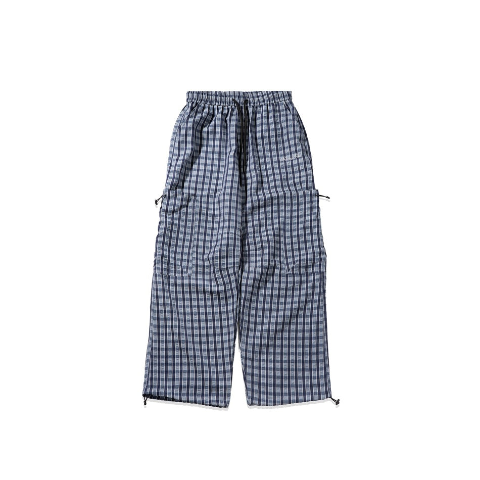 Blue and navy plaid wide-leg pants with drawstring waist, thigh patch pockets and drawcord hems on white background
