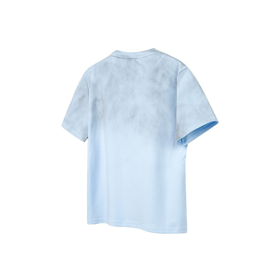 Back view of a pale blue short-sleeve crew-neck T-shirt with subtle mottled shading and no visible back graphic.