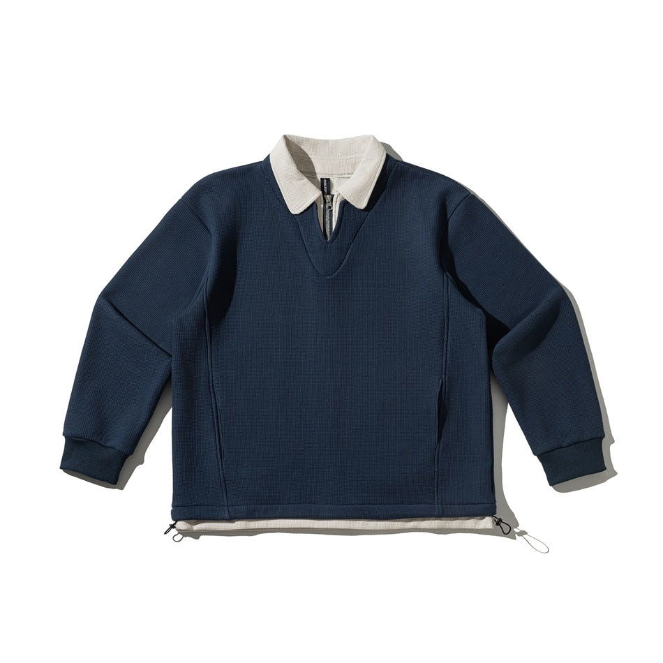 Navy waffle-textured pullover sweatshirt with cream polo collar, quarter-zip neckline and drawcord hem, flat lay
