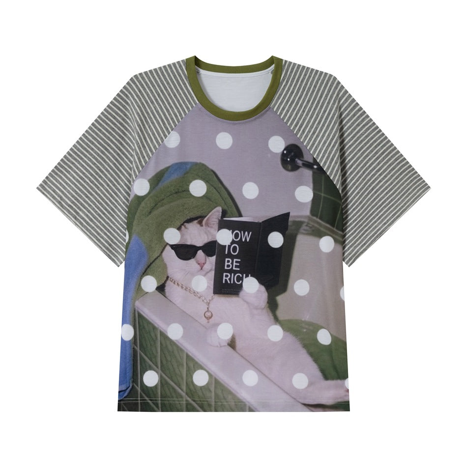 Striped raglan-sleeve T-shirt with olive collar and printed cat in sunglasses reading a book, with white polka dots