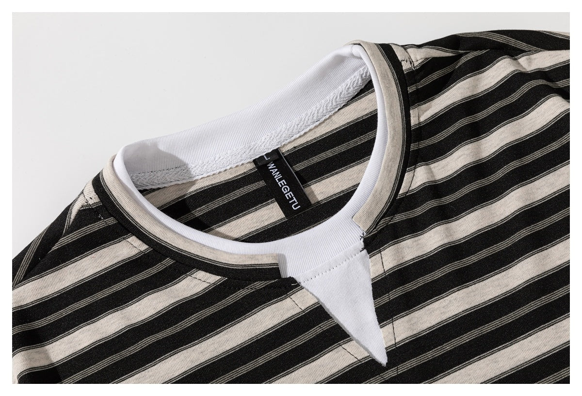 Close-up of the black and beige striped T-shirt neckline, white inner trim, and sewn neck label.