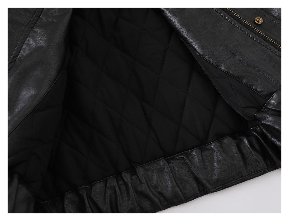 Close-up of the black jacket's interior diamond-quilted lining and gathered hem.