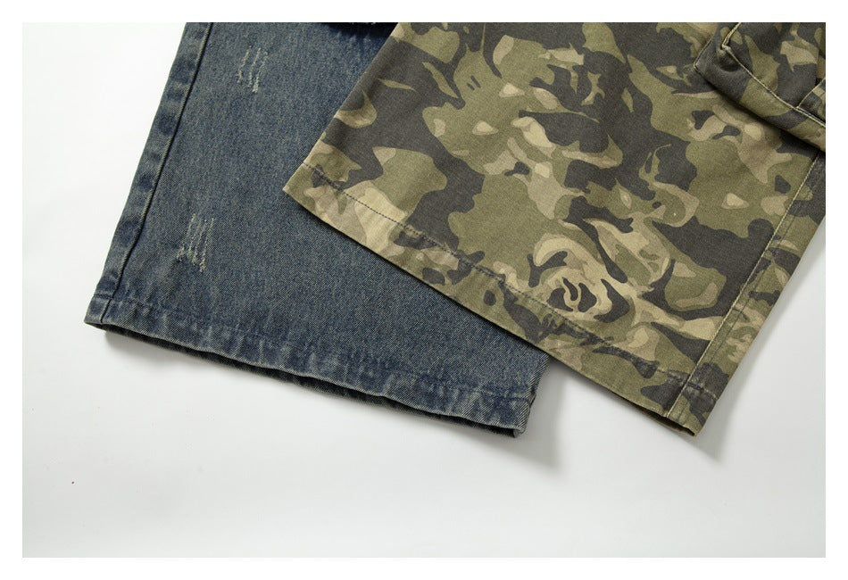Close-up of the hems of faded blue denim and olive camouflage fabric side by side.