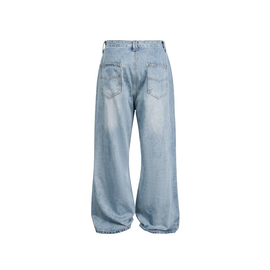 Rear view of light blue, wide-leg jeans with two back pockets and belt loops on a white background.
