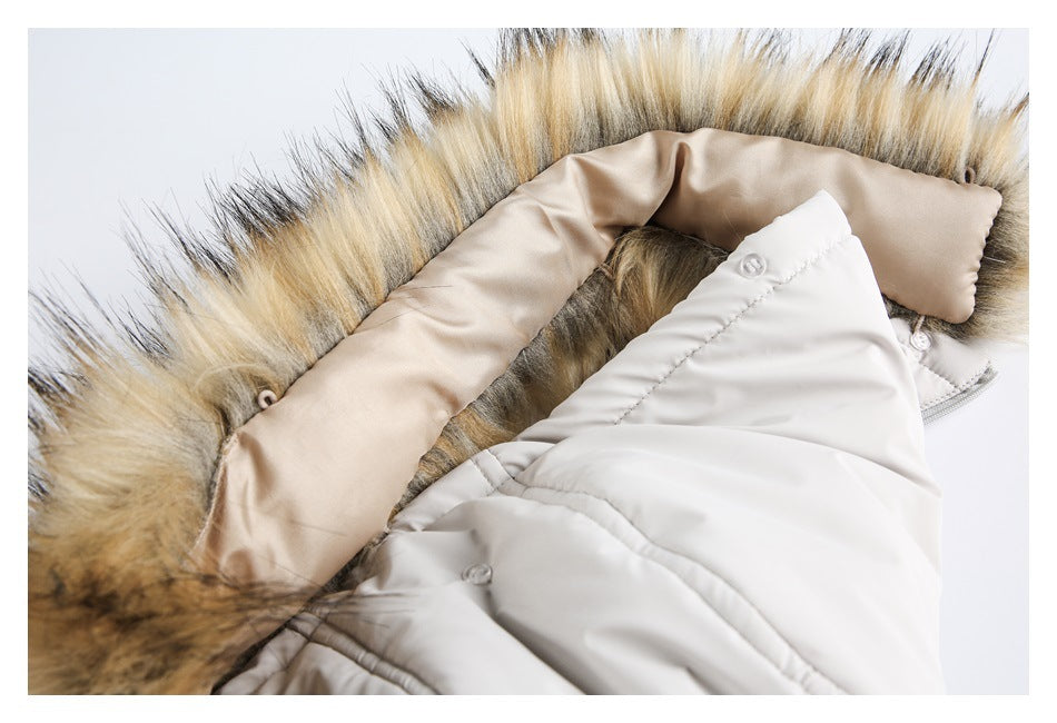 Close-up of the coat's fur-trimmed hood, beige inner lining, and light-colored front panel.