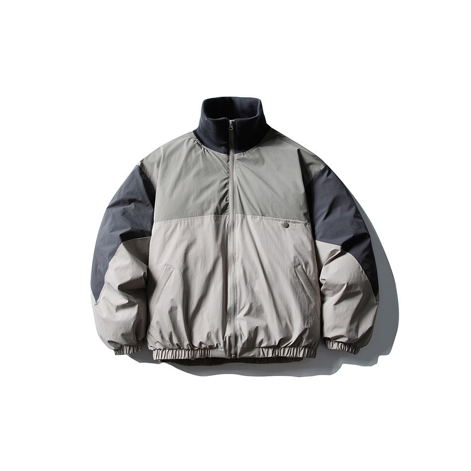 Gray and slate-blue color-block zip jacket with ribbed stand collar and elastic hem, front flat view