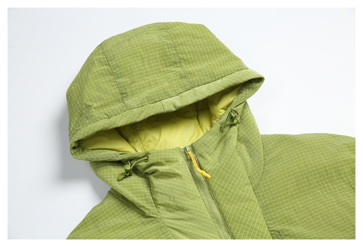 Close-up of the lime green grid-pattern jacket hood, bright lining, drawcord toggles, and zipper.