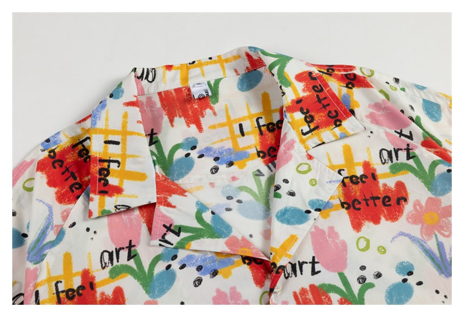 Close-up of a white shirt collar and lapels with colorful abstract artwork and black English lettering.