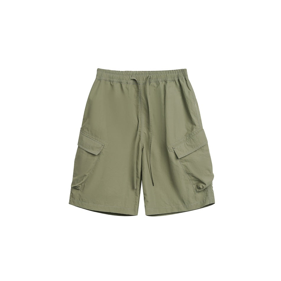 Army green cargo shorts with elastic drawstring waist and large side flap pockets, flat lay front view
