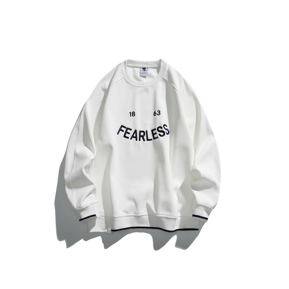 White crew-neck sweatshirt with FEARLESS 18 63 chest lettering and dark stripe trim at the cuffs and hem