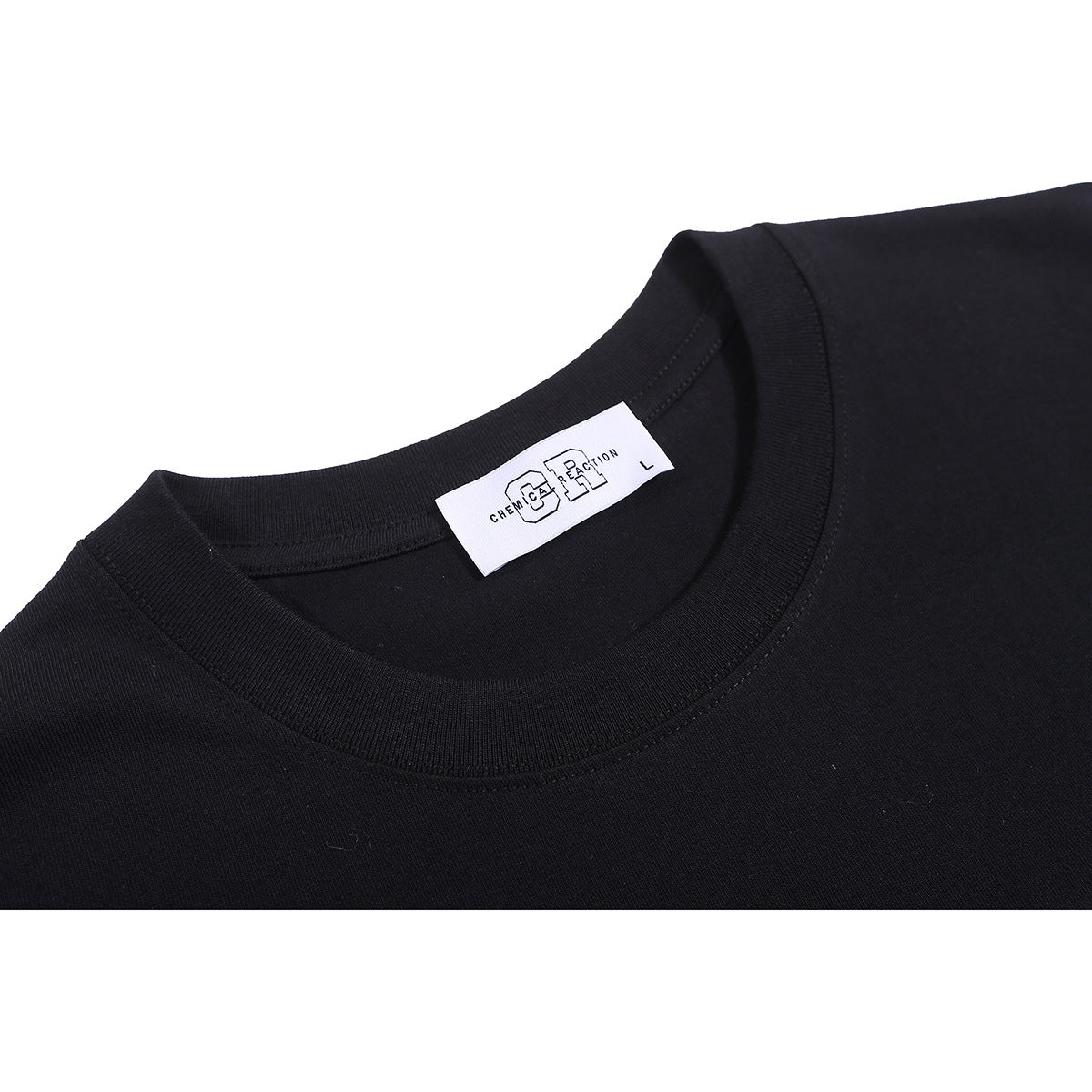 Close-up of a black T-shirt's ribbed crew neck and white brand label.