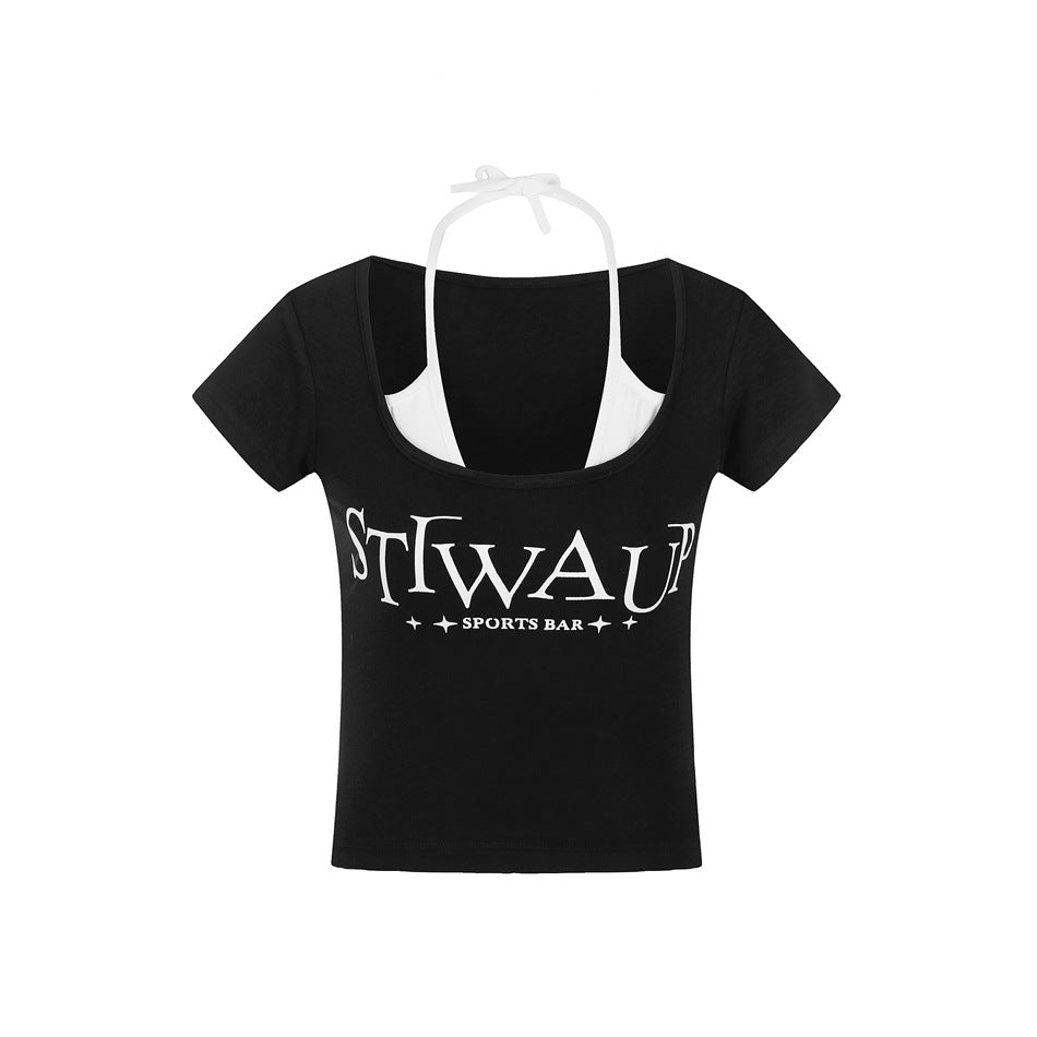 Black cropped short-sleeve tee with scoop neck, white halter layer and white chest lettering print, flat view