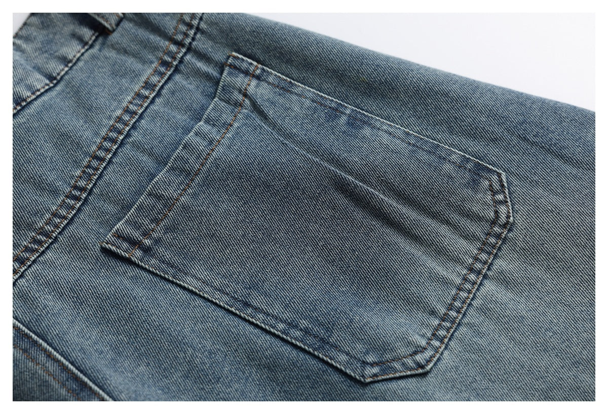 Close-up of a blue jeans back pocket with contrasting brown stitching.
