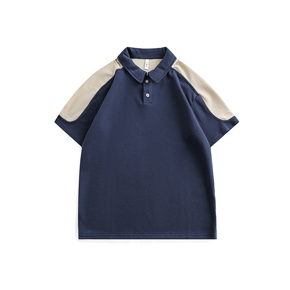 Navy short-sleeve polo shirt with beige shoulder and sleeve panels and beige buttons, flat front view