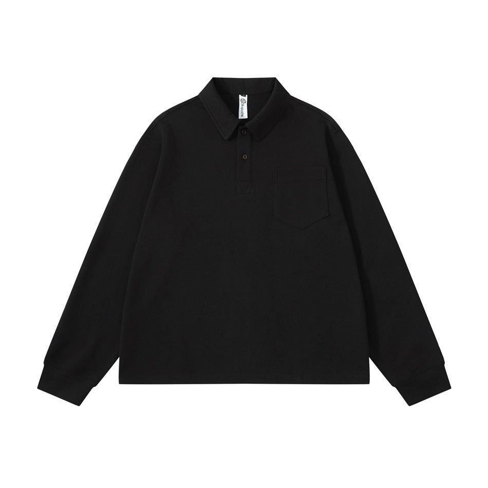 Black long-sleeve polo-collar top with two buttons and chest patch pocket, flat lay front view
