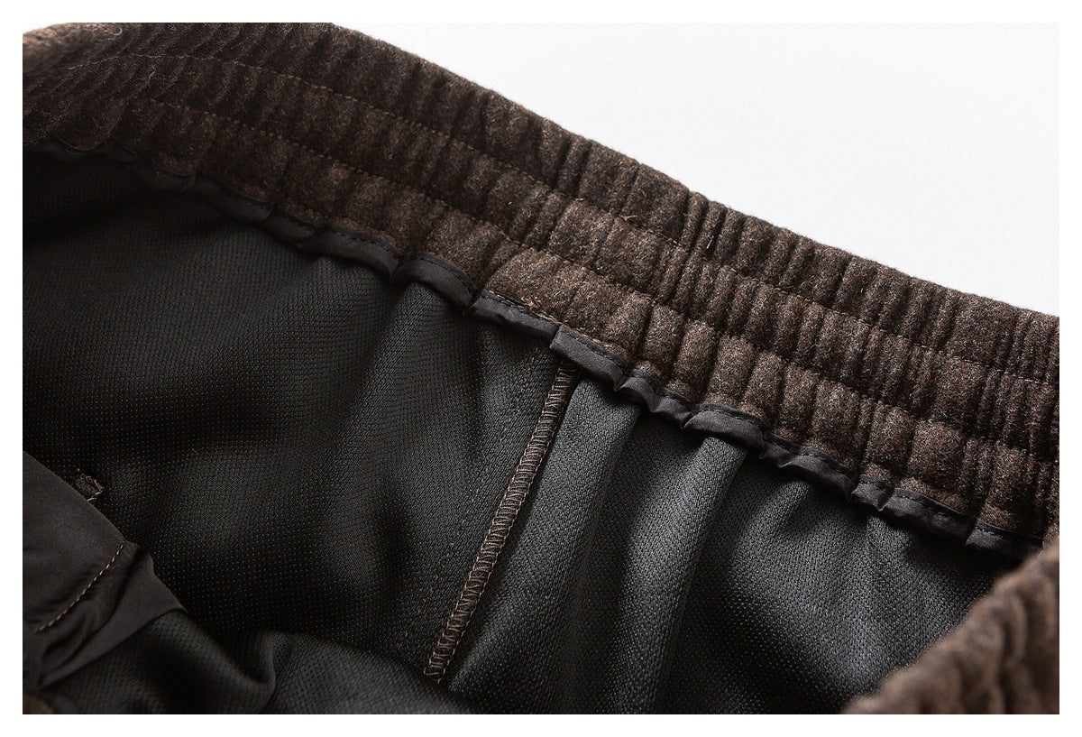 Close-up of a brown elastic waistband and black inner lining with visible seams.