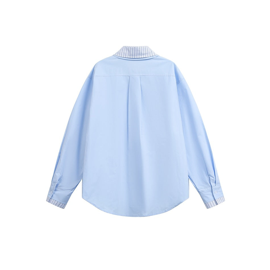 Back view of a light blue long-sleeve shirt with a striped collar and cuffs.