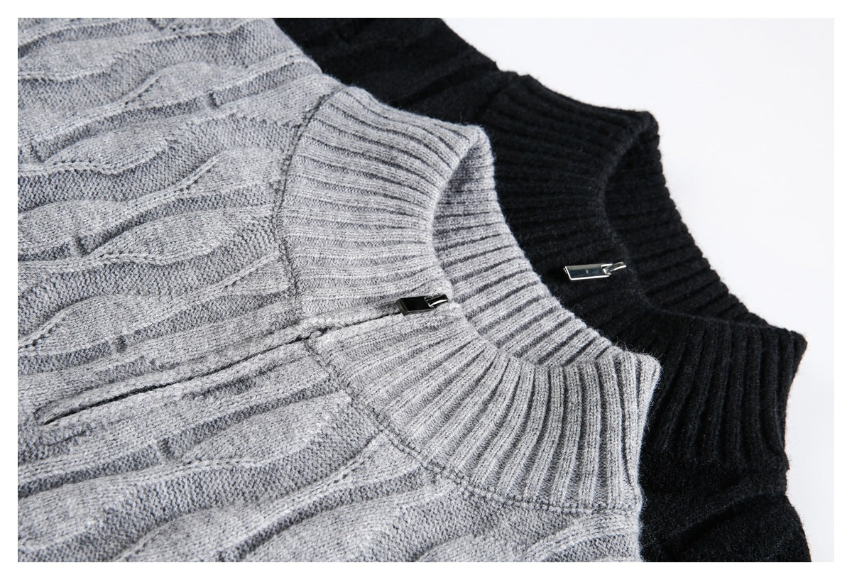 Close-up of gray and black cable-knit sweater collars with small metal accents.