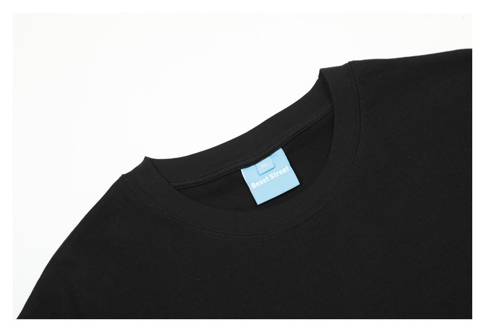 Close-up of a black T-shirt crew neck and blue size XL label.