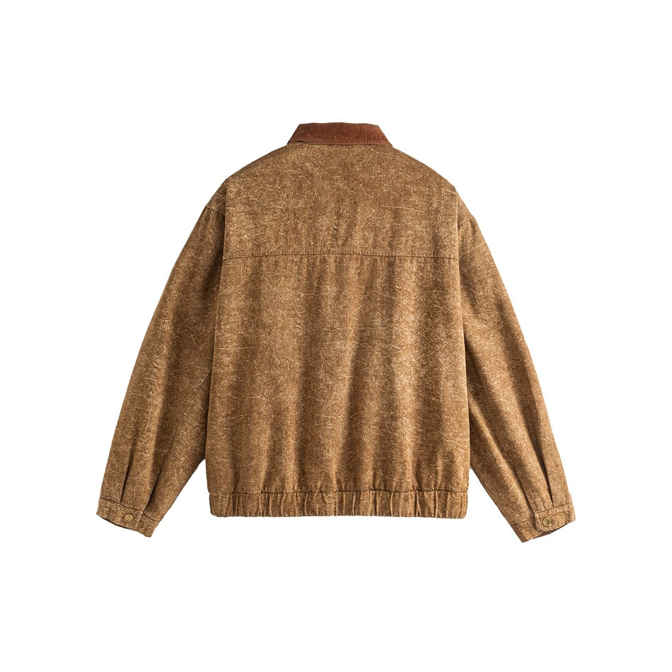 Back view of a mottled tan jacket with a brown collar, long sleeves, button cuffs, and an elasticized hem.