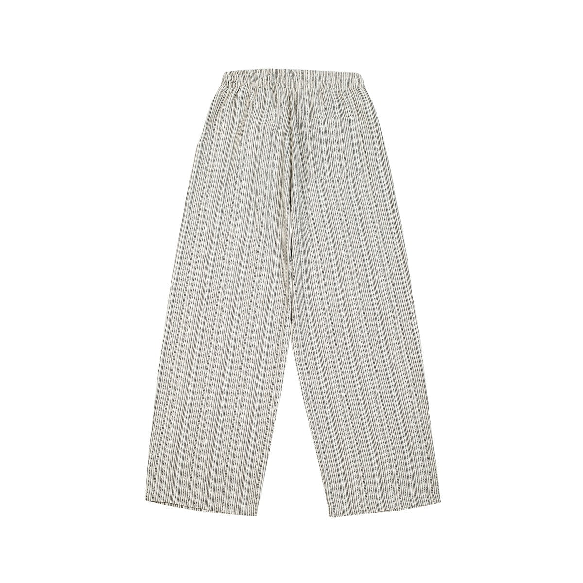 Back view of cream-and-black striped wide-leg trousers with an elastic waist and a single patch pocket.