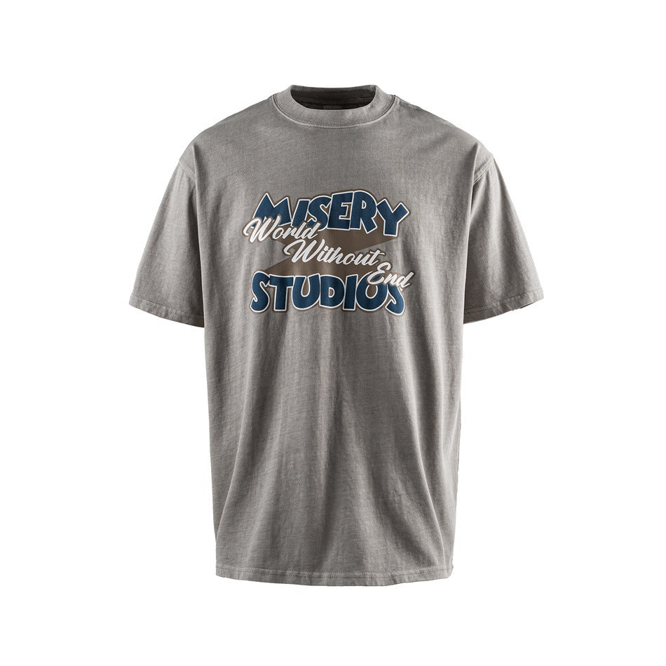 Cement gray short-sleeve crew-neck T-shirt with navy 'MISERY World Without End STUDIOS' chest print, front view