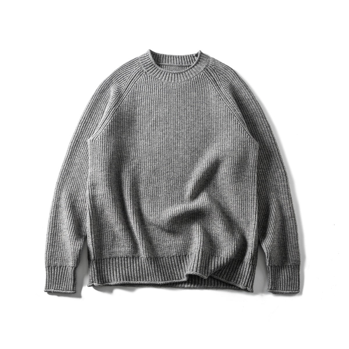 Gray ribbed knit crew-neck raglan sweater laid flat, front view