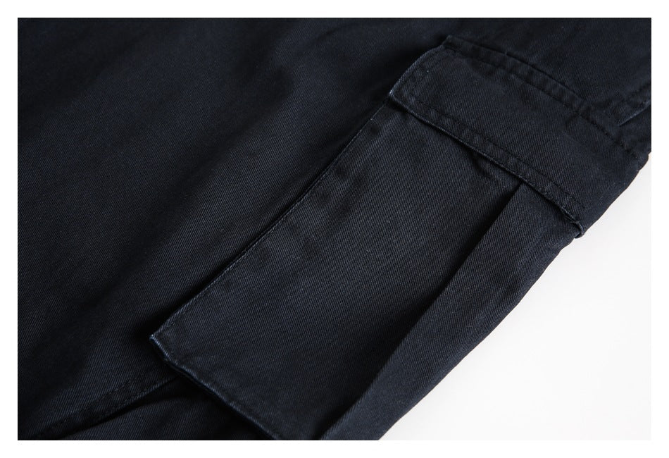 Close-up of a large rectangular cargo pocket on black trousers.