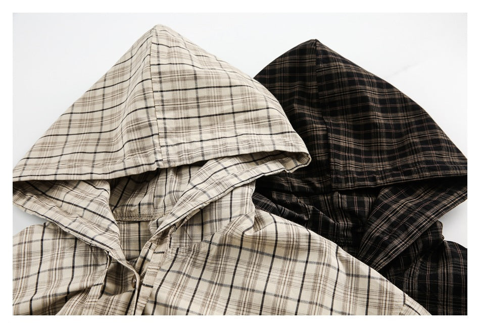 Cream and black plaid hooded shirts overlap, with both hoods and part of their button fronts visible.
