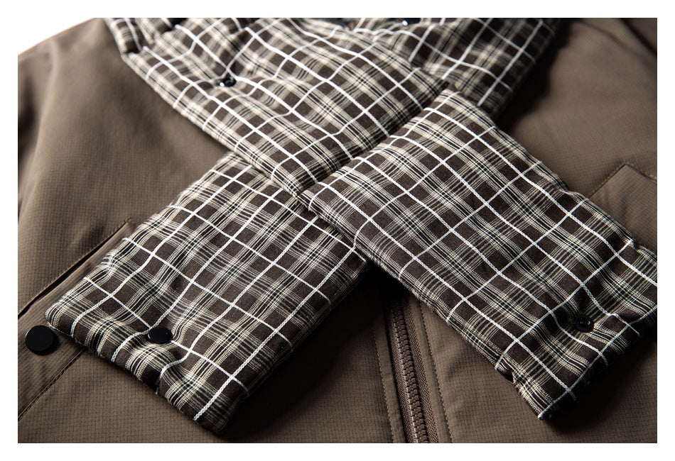 Close-up of the jacket's plaid-lined sleeves, snap cuffs, and front zipper.