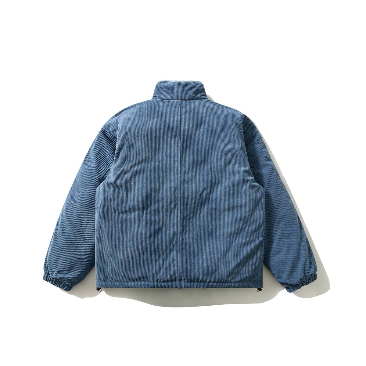 Back view of a blue jacket with a high collar, ribbed sleeves, and a plain center seam.