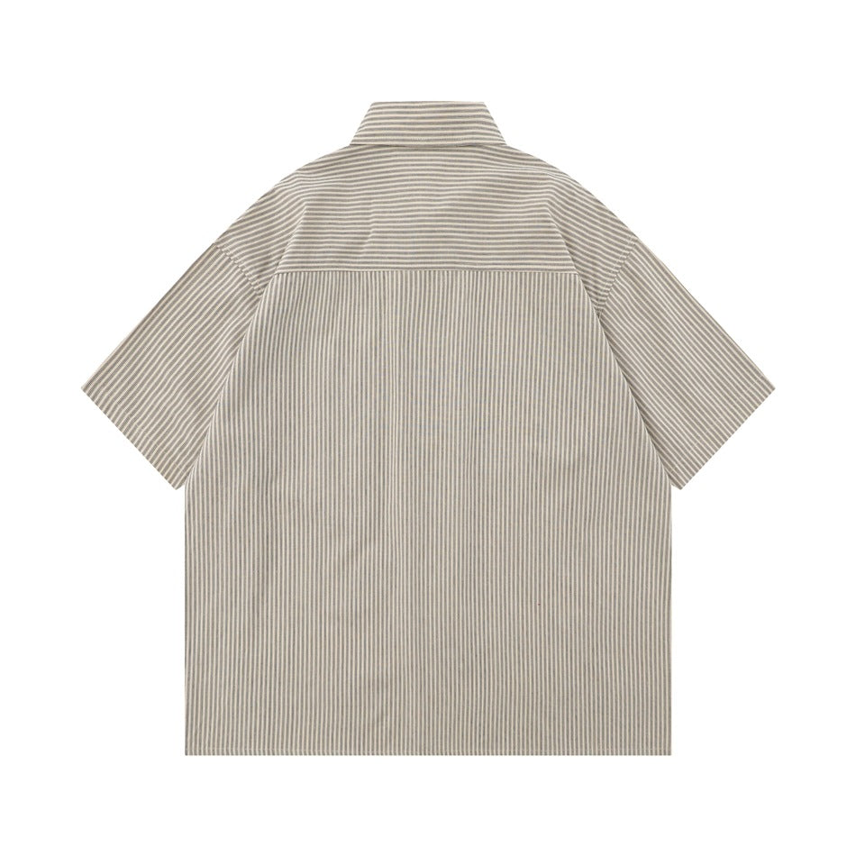 Back view of a light beige short-sleeve shirt with fine gray stripes and a horizontal yoke.