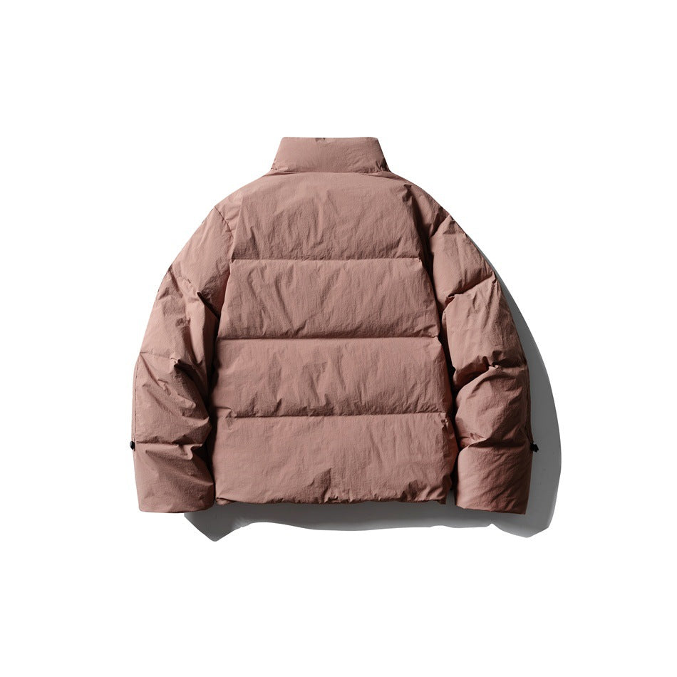 Back view of a dusty rose puffer jacket with a high collar and horizontal quilted panels.