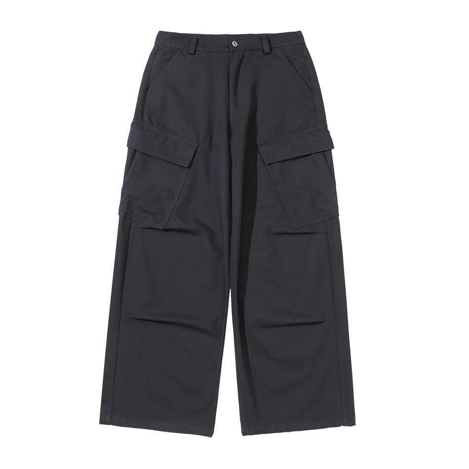 Black wide-leg cargo pants flat lay, front view, with large flap thigh pockets and knee pleats