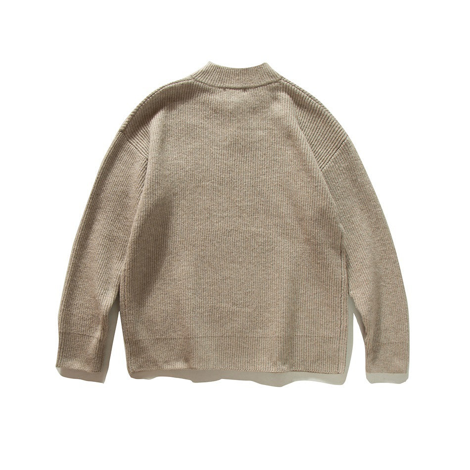Back view of a khaki ribbed knit pullover sweater with a ribbed crew collar and drop shoulders