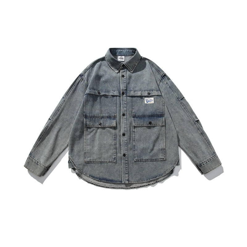 Front flat lay of blue-gray washed denim jacket with large flap chest pockets and button front