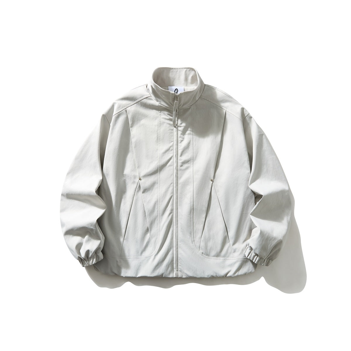 Light gray stand-collar zip jacket with angled front seams, elastic cuffs and hem, flat lay front view