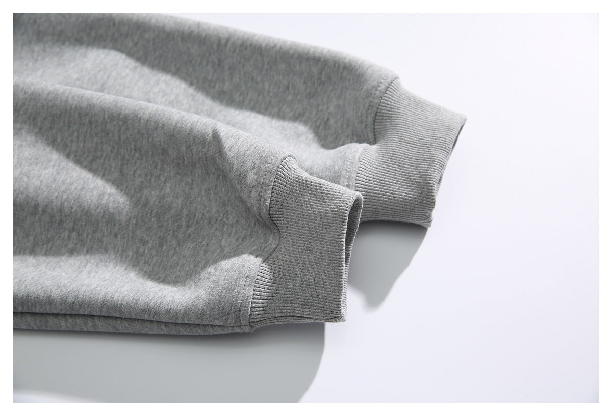 Close-up of the gray hoodie’s ribbed sleeve cuffs.