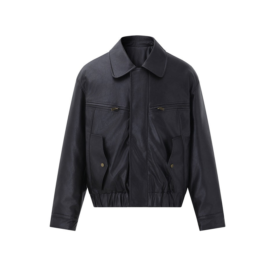 Black faux-leather-look jacket, front flat view with pointed collar, chest zip pockets, snap flap pockets and elastic hem