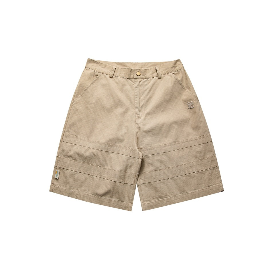 Khaki knee-length work shorts, front flat lay, with button closure, front pockets and horizontal stitched bands on the legs