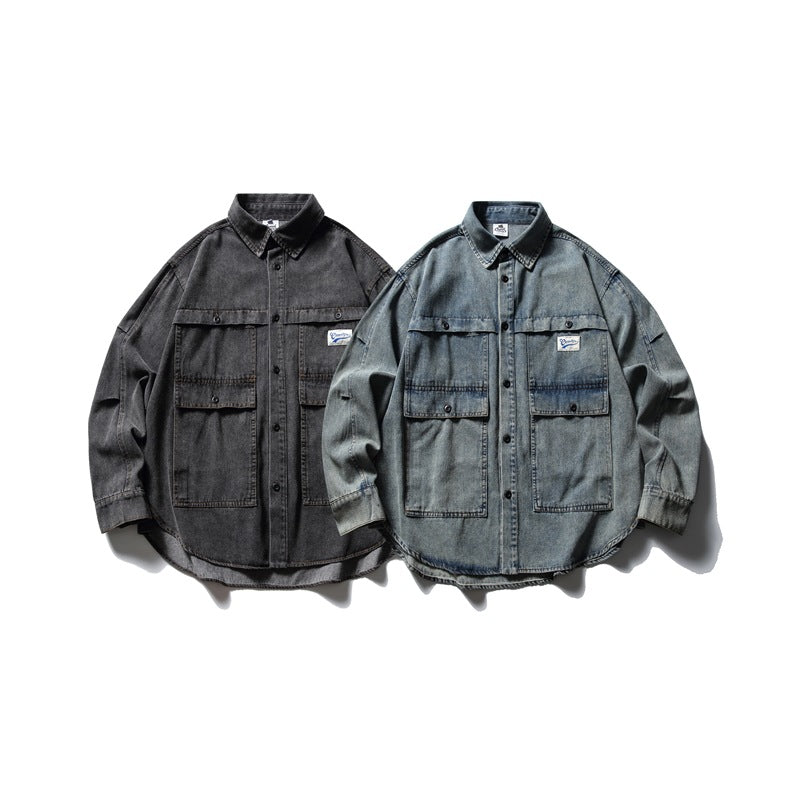 Two denim shirt jackets shown from the front: one charcoal gray and one faded blue-gray, each with large flap pockets.