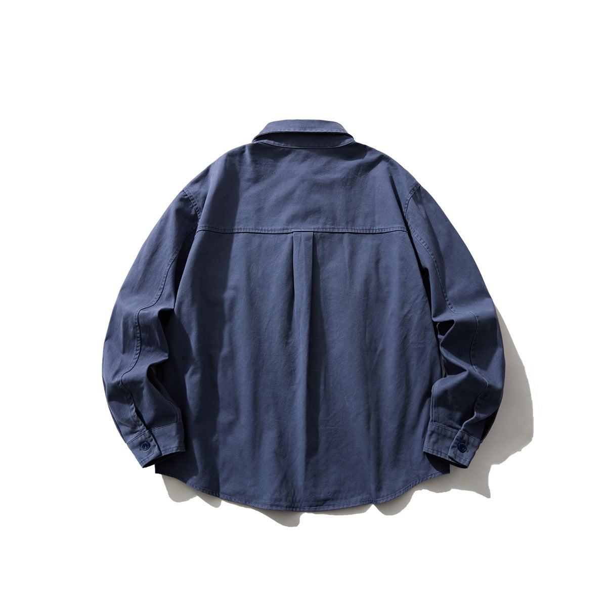 Back view of a dark navy long-sleeve button-up shirt with a center pleat and curved hem.
