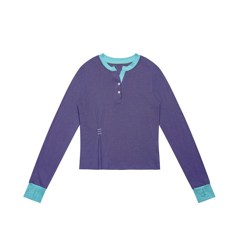 Purple long-sleeve henley top with turquoise collar, placket facing and cuffs, flat lay on white