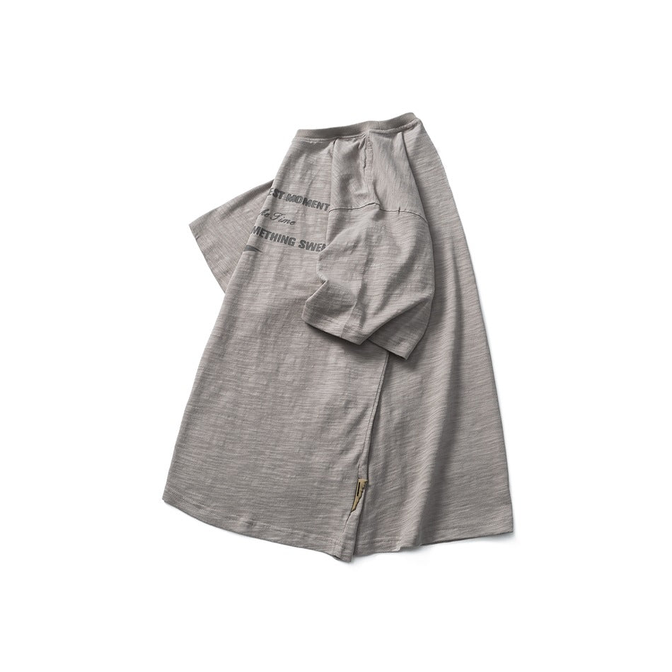 Gray marled short-sleeve T-shirt displayed at an angle, with dark English lettering partly visible on the chest.