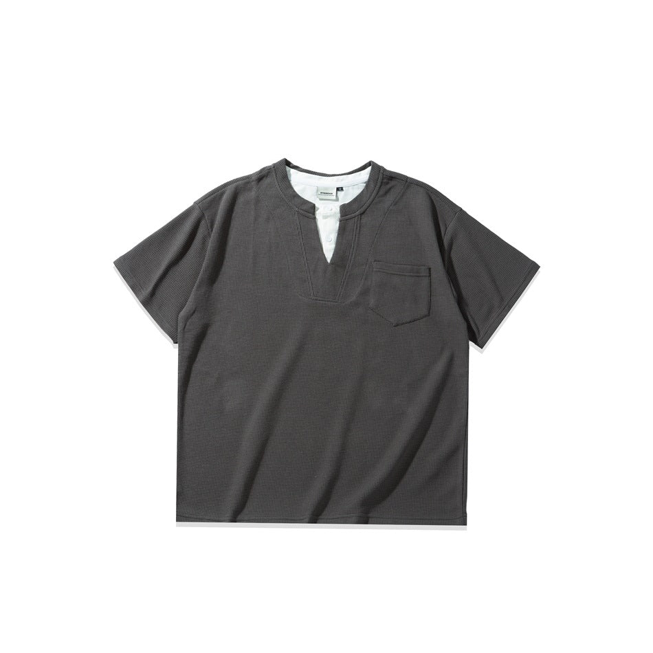 Dark gray short-sleeve waffle-knit tee with notched V-neck, white buttoned inner placket and chest pocket, flat lay