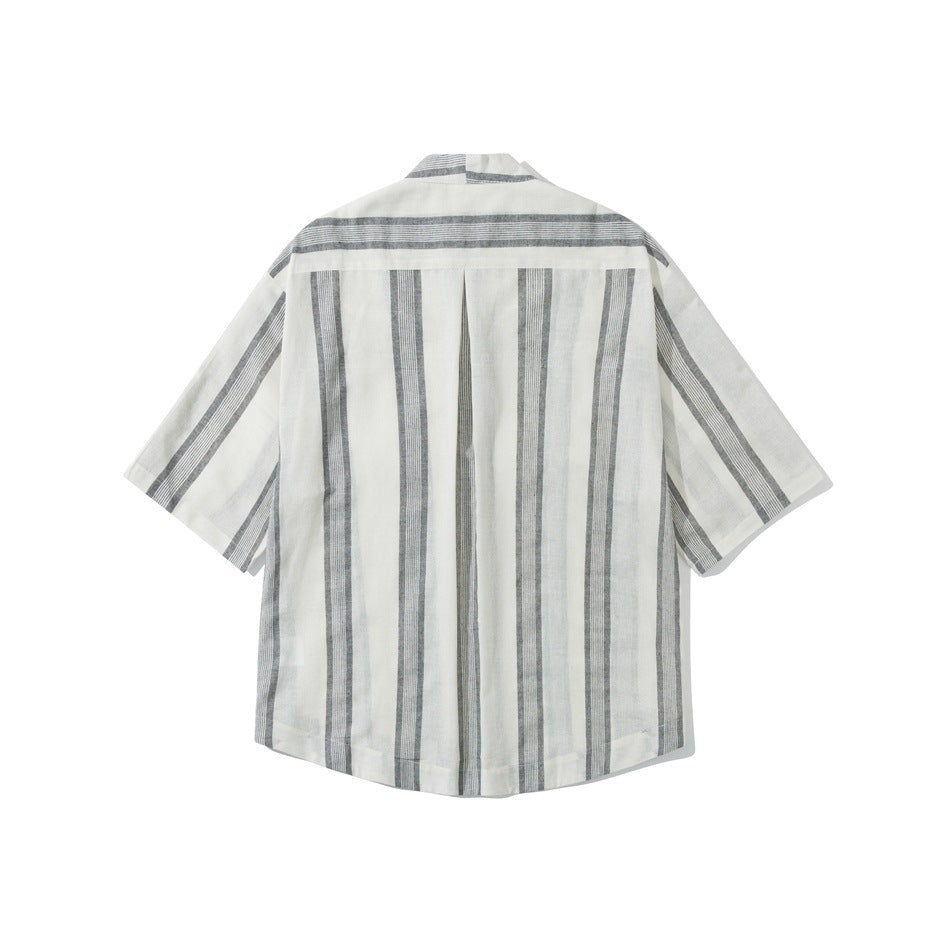 Back of white shirt with gray vertical stripes, center pleat and curved hem, laid flat