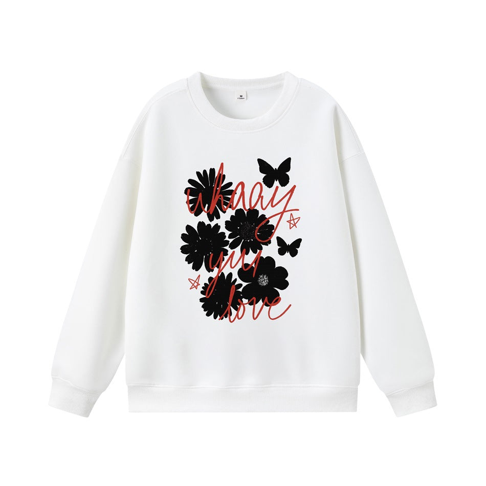 White crewneck sweatshirt with black flower and butterfly print and red script lettering on the front